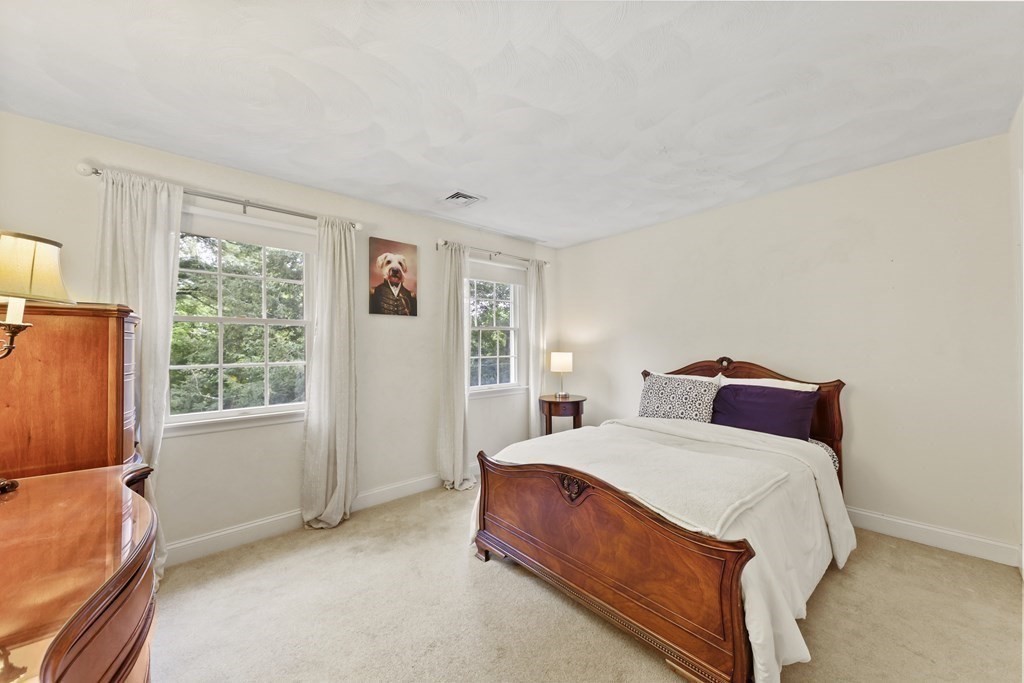 104 Forest Street Middleton, MA 01949 - Photo 23 of 41 a bedroom with a bed and a window