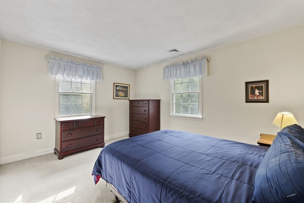 104 Forest Street Middleton, MA 01949 - Photo 25 of 41 a bedroom with a bed and window