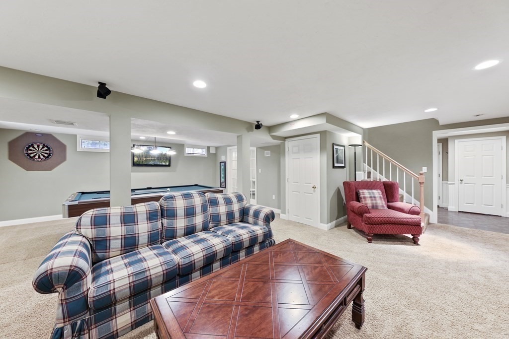 104 Forest Street Middleton, MA 01949 - Photo 30 of 41 a bedroom with furniture and stairs