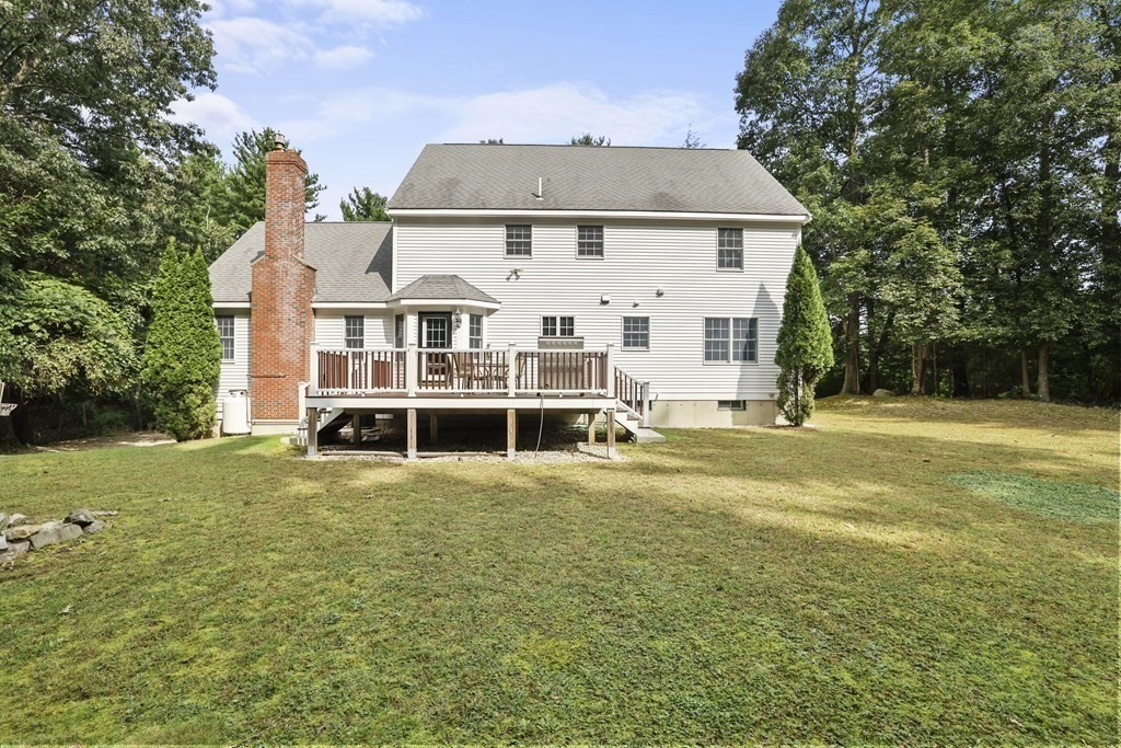 104 Forest Street Middleton, MA 01949 - Photo 37 of 41 a front view of a house with a yard