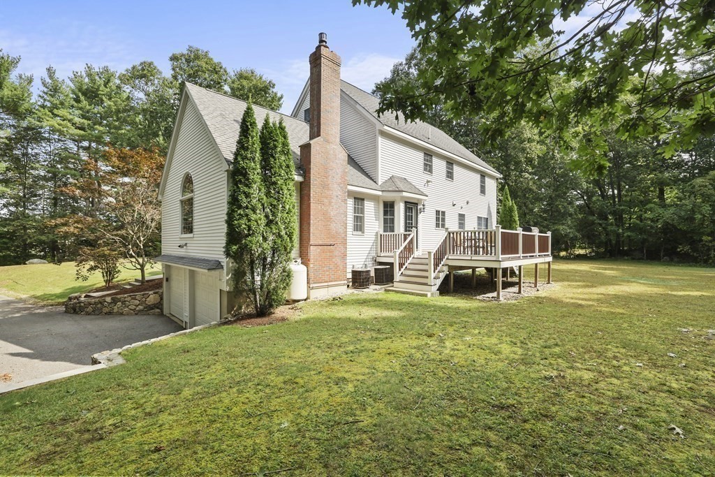 104 Forest Street Middleton, MA 01949 - Photo 38 of 41 a view of a house with yard and sitting area