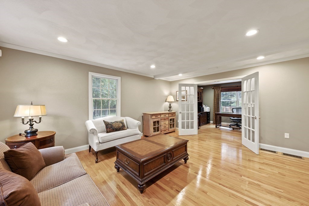 104 Forest Street Middleton, MA 01949 - Photo 4 of 41 a living room with furniture and a wooden floor