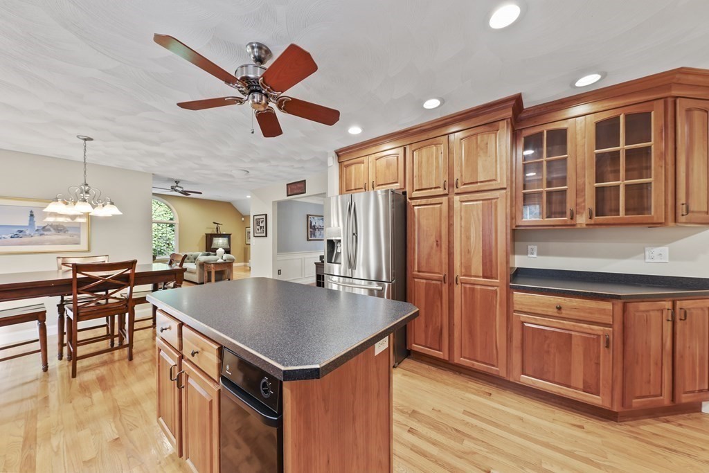 104 Forest Street Middleton, MA 01949 - Photo 7 of 41 a kitchen with stainless steel appliances granite countertop a refrigerator a sink and a stove