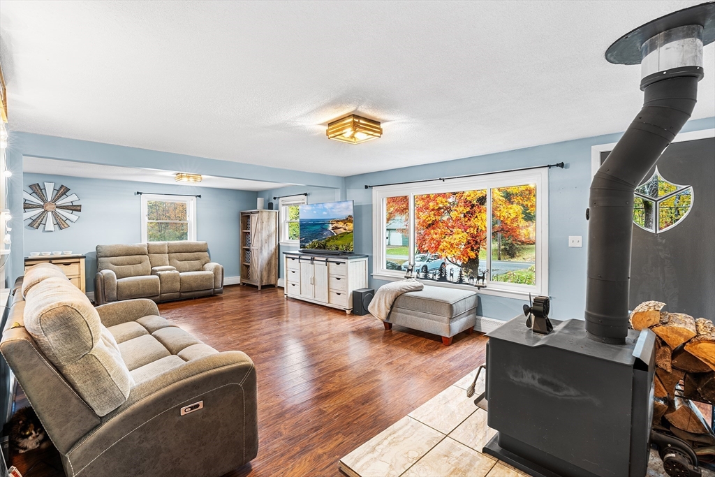 73 North Common Road Westminster, MA 01473 - Photo 14 of 41 a living room with furniture and floor to ceiling windows