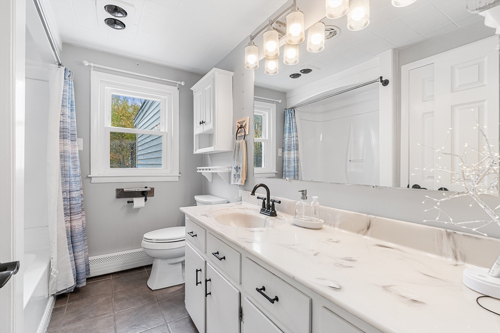73 North Common Road Westminster, MA 01473 - Photo 18 of 41 a bathroom with a double vanity sink mirror and toilet