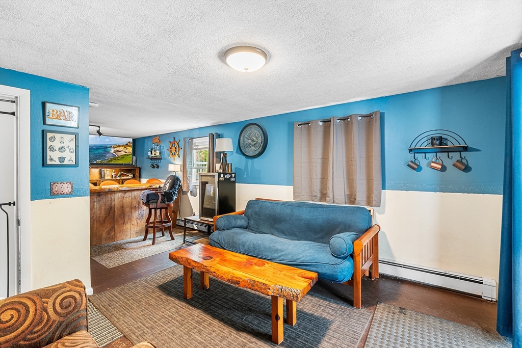 73 North Common Road Westminster, MA 01473 - Photo 19 of 41 a living room with furniture and a table