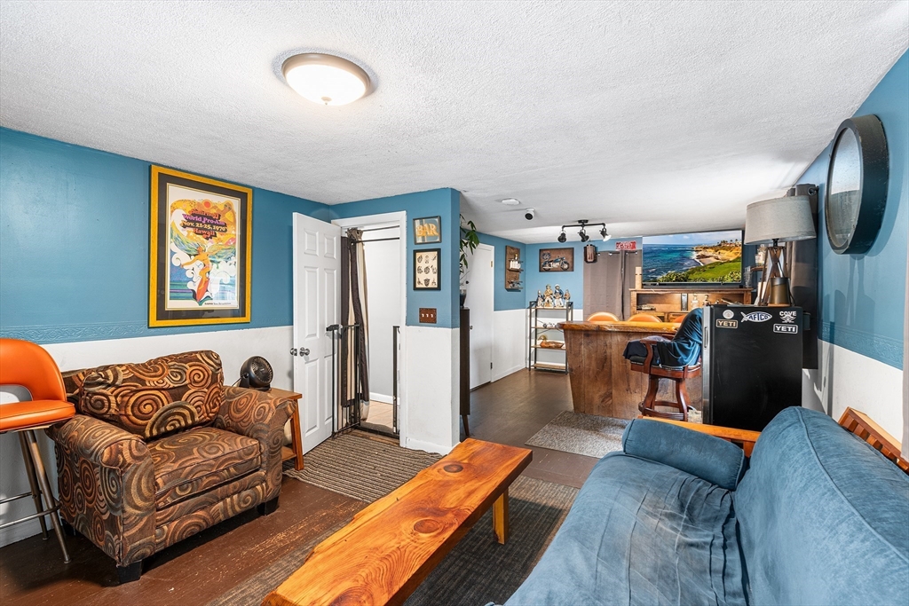 73 North Common Road Westminster, MA 01473 - Photo 20 of 41 a living room with furniture fireplace and flat screen tv