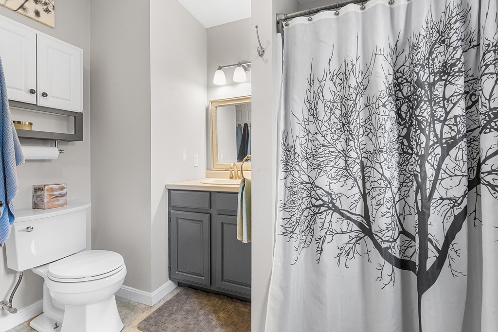 73 North Common Road Westminster, MA 01473 - Photo 25 of 41 a bathroom with a toilet sink and cabinets