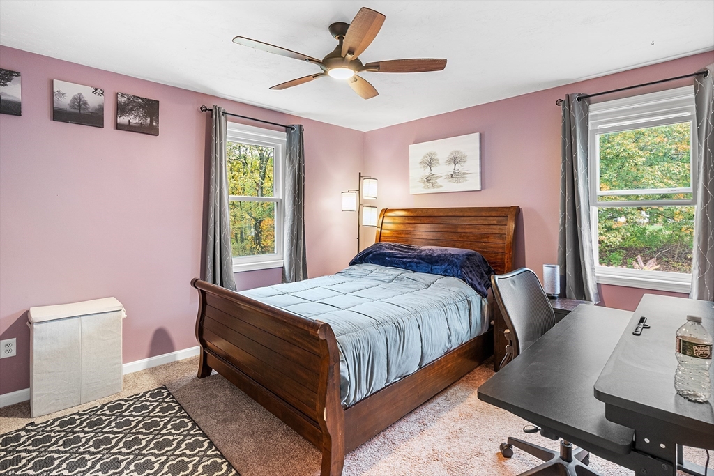 73 North Common Road Westminster, MA 01473 - Photo 27 of 41 a bedroom with a bed and a table in it with window