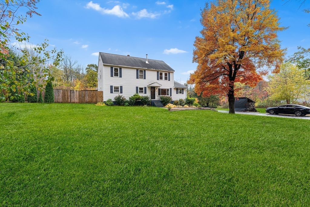 73 North Common Road Westminster, MA 01473 - Photo 38 of 41 a view of a white house with a big yard and large trees