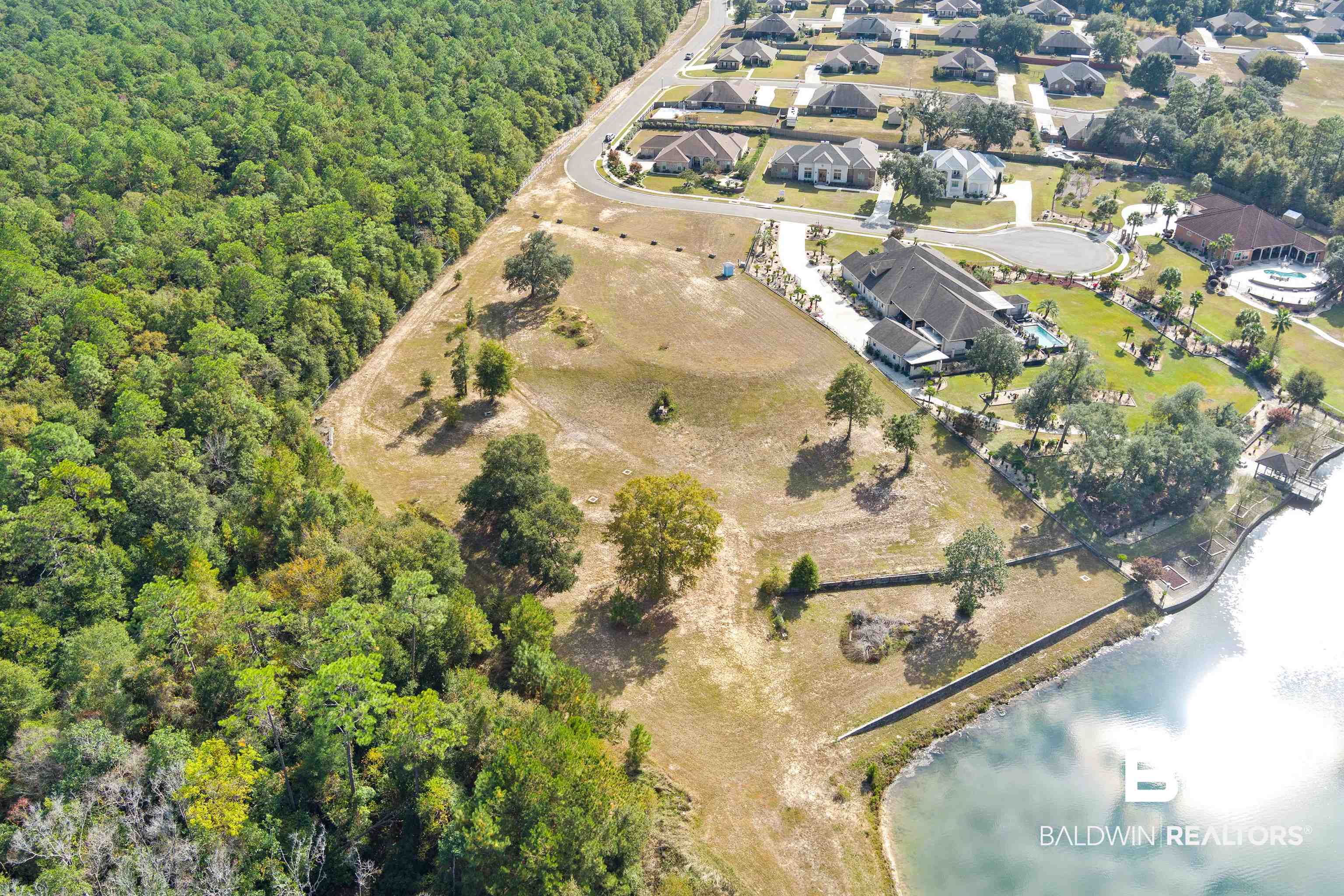 8512 Crepe Myrtle Court Mobile, AL 36619 - Photo 9 of 10 View of property location with a large body of water and a forest