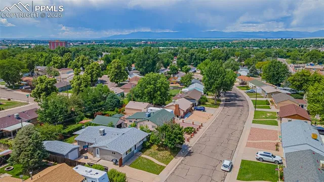 an aerial view of a house with outdoor space and street view