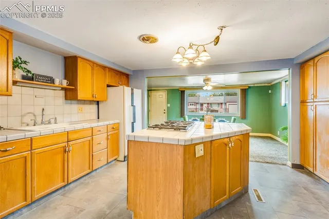 a view of a kitchen counter top space with granite countertop furniture and a kitchen