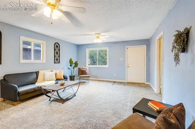 a living room with furniture and window