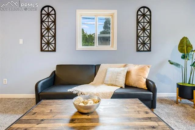a living room with furniture and a window