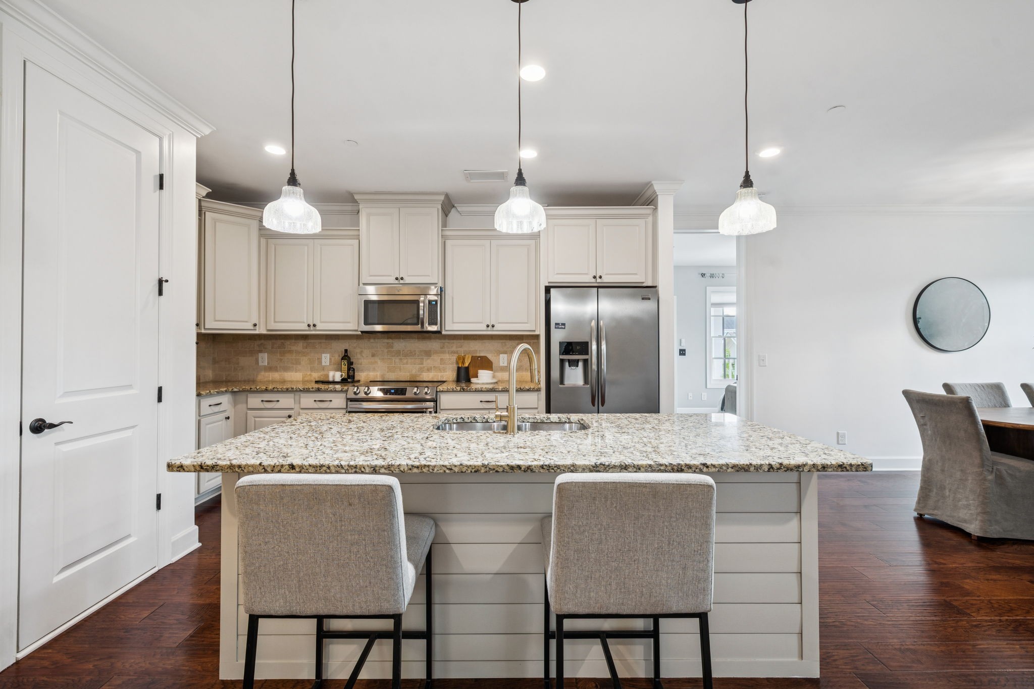 6000 Keats Street, Unit 202 Franklin, TN 37064 - Photo 15 of 47 a kitchen with stainless steel appliances granite countertop a kitchen island hardwood floor sink and stove