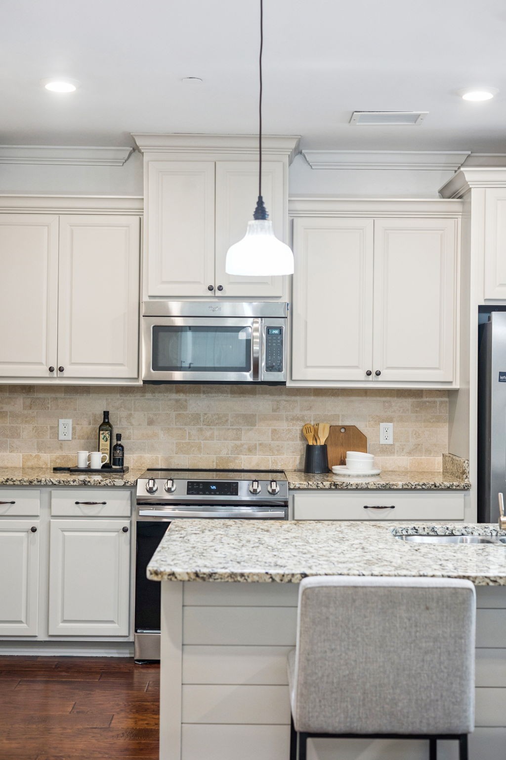 6000 Keats Street, Unit 202 Franklin, TN 37064 - Photo 16 of 47 a kitchen with granite countertop a sink a stove and cabinets