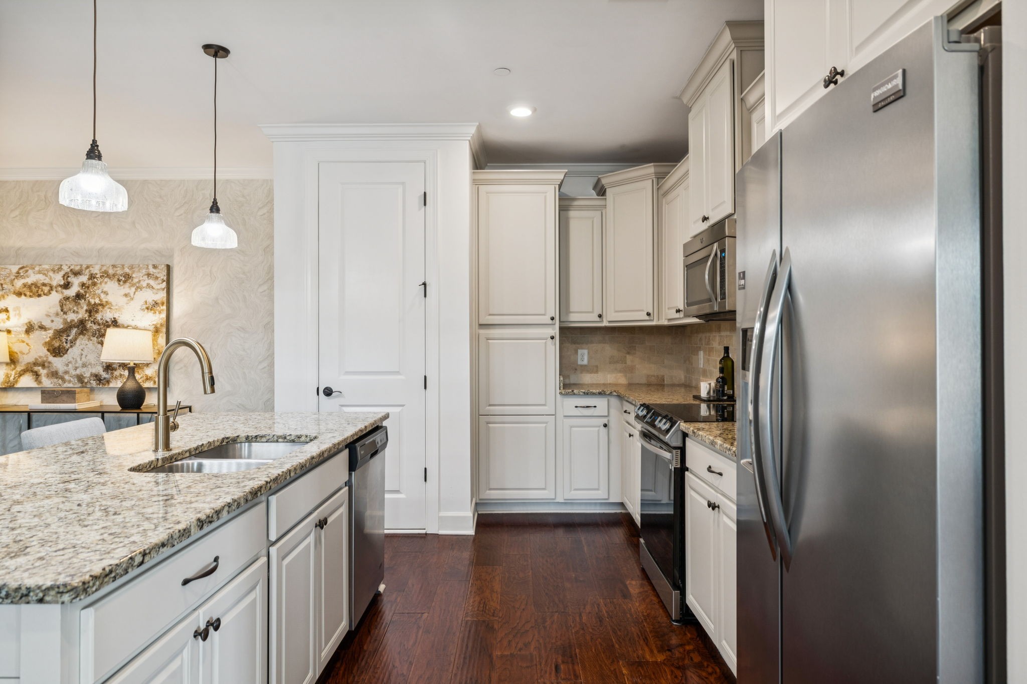 6000 Keats Street, Unit 202 Franklin, TN 37064 - Photo 19 of 47 a kitchen with kitchen island granite countertop a sink appliances cabinets and counter space