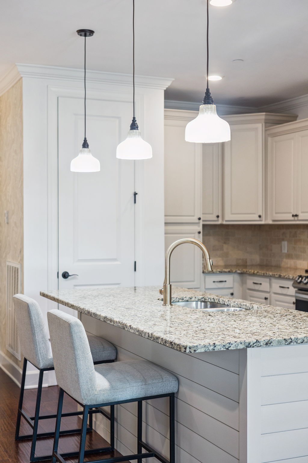 6000 Keats Street, Unit 202 Franklin, TN 37064 - Photo 20 of 47 a kitchen with granite countertop a sink a center island a cabinets and a wooden floor