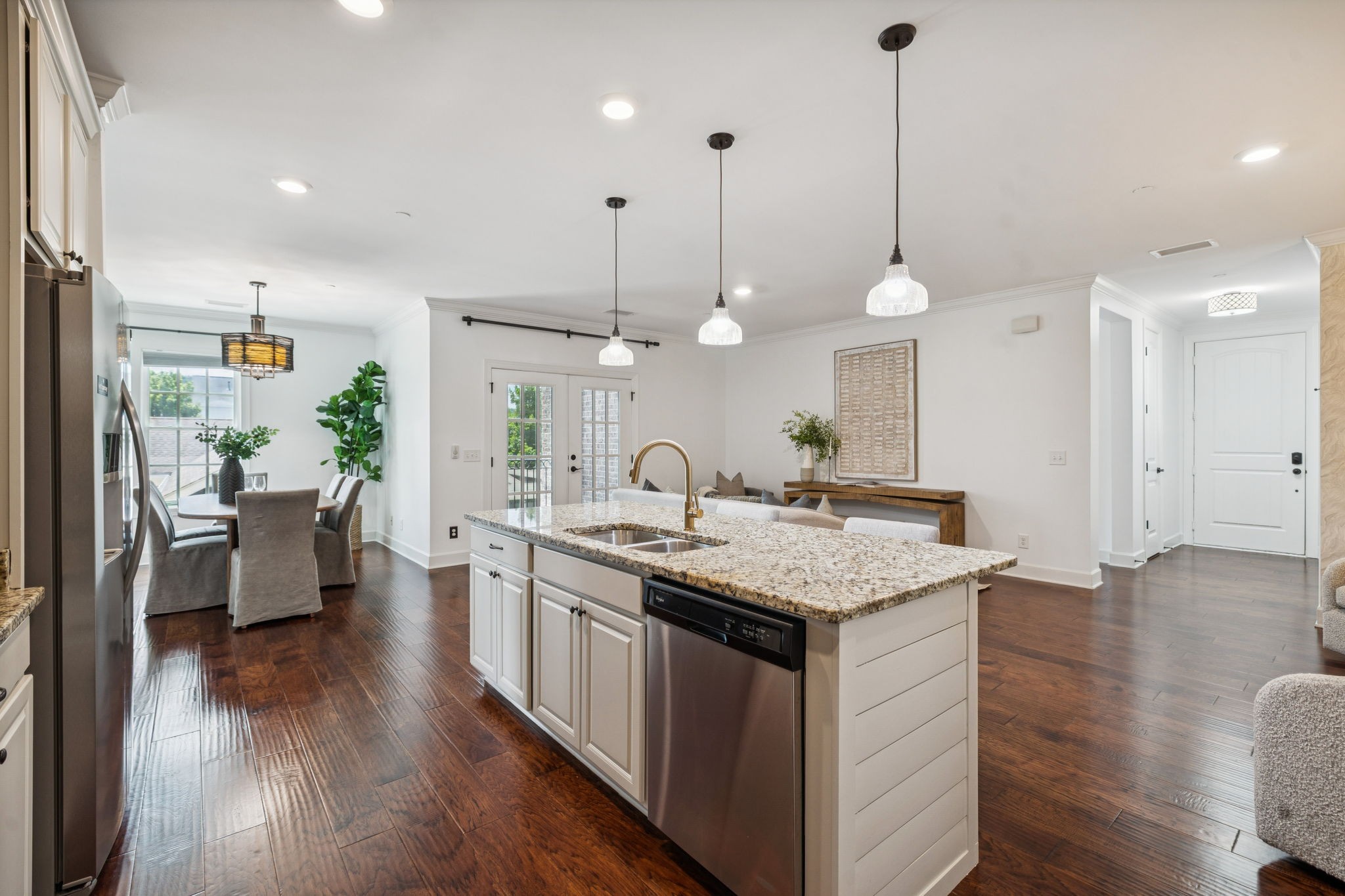 6000 Keats Street, Unit 202 Franklin, TN 37064 - Photo 23 of 47 a kitchen with stainless steel appliances granite countertop wooden floors sink stove and wooden floor