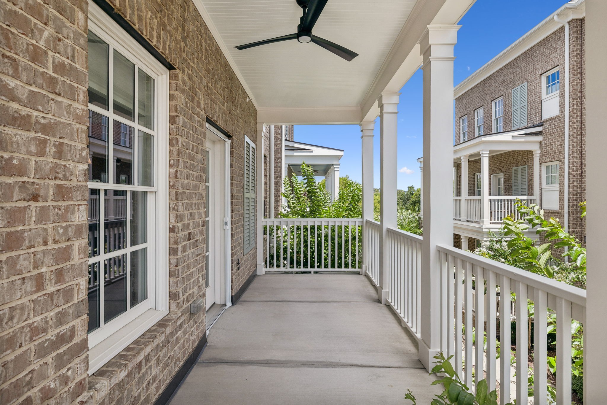 6000 Keats Street, Unit 202 Franklin, TN 37064 - Photo 39 of 47 a view of a balcony with a floor to ceiling window and stairs
