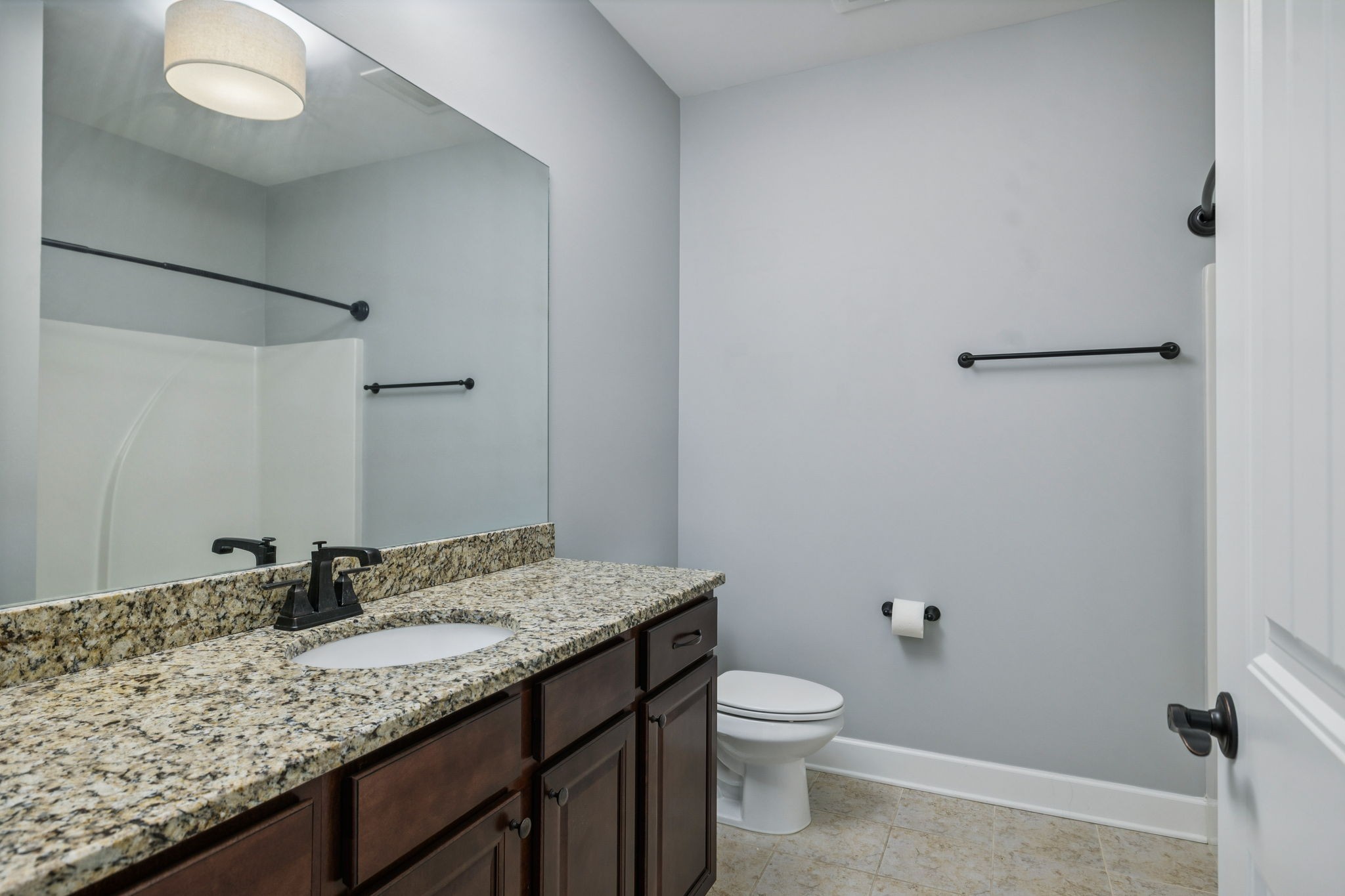 6000 Keats Street, Unit 202 Franklin, TN 37064 - Photo 41 of 47 a bathroom with a granite countertop sink and a mirror