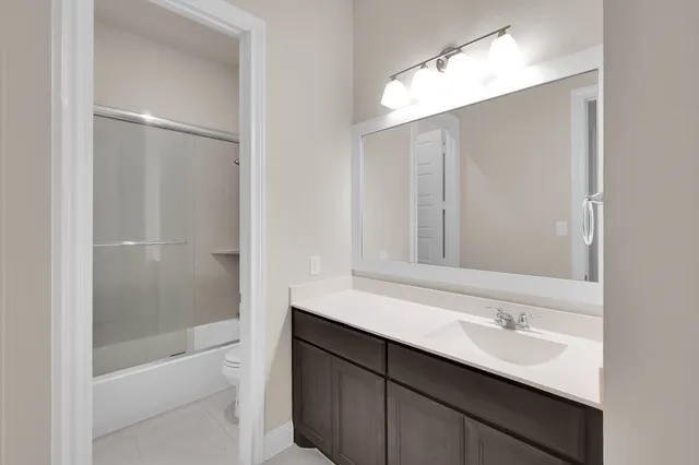 a bathroom with a bathtub and a sink