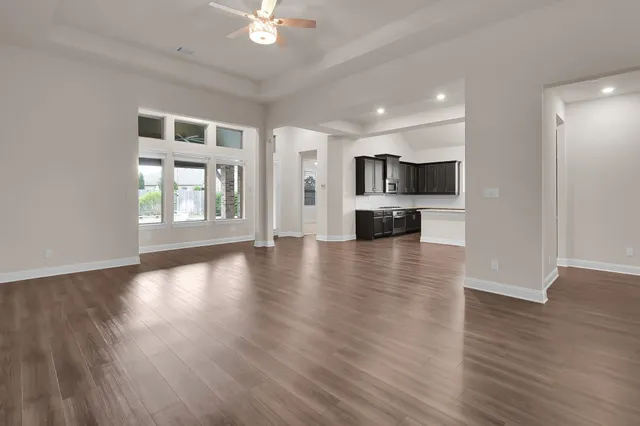a view of kitchen with furniture and wooden floor