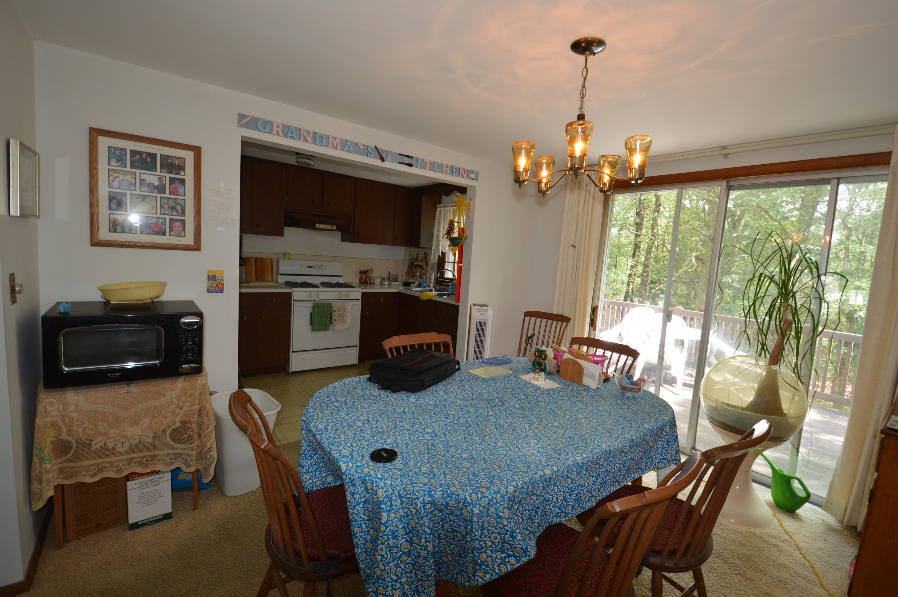 70 Geraldine Road Cotuit, MA 02635 - Photo 5 of 10 a view of a dining room with furniture window and outside view