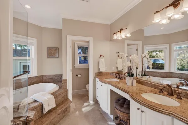 a bath tub sitting in a bathroom next to a window