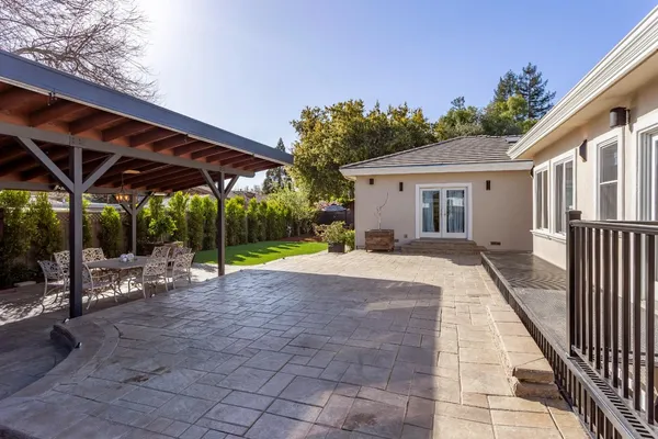 a view of an outdoor space with table and chairs