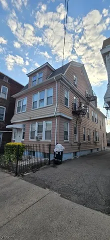 a car parked in front of a brick house