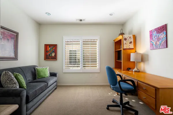 a workspace with furniture and a window