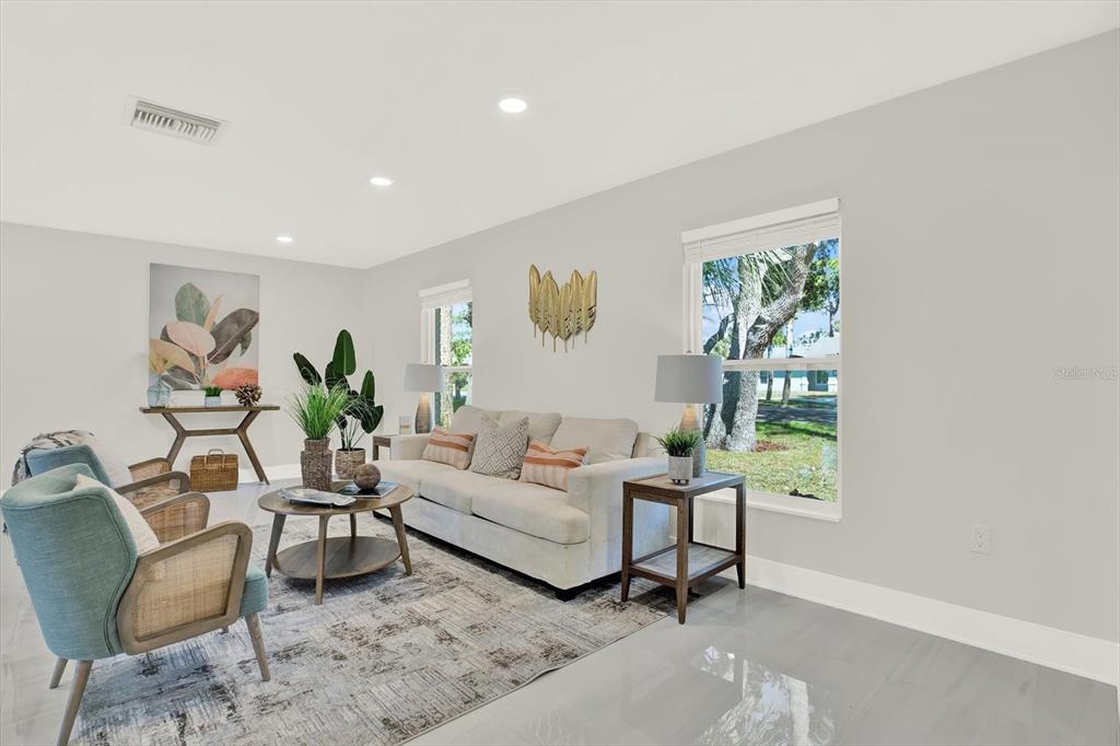 4346 Marine Parkway New Port Richey, FL 34652 - Photo 13 of 61 a living room with furniture and a potted plant