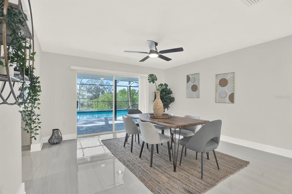 4346 Marine Parkway New Port Richey, FL 34652 - Photo 14 of 61 a view of a dining room with furniture window and wooden floor
