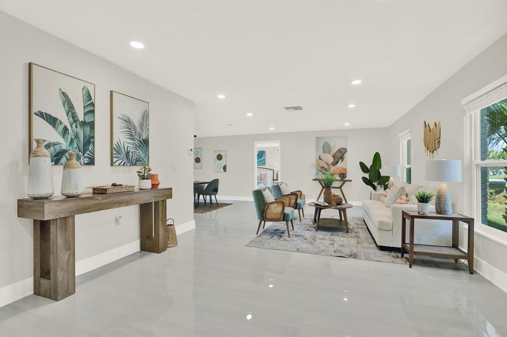 4346 Marine Parkway New Port Richey, FL 34652 - Photo 15 of 61 a living room with furniture a large window and chairs