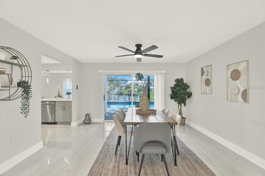 4346 Marine Parkway New Port Richey, FL 34652 - Photo 17 of 61 a dining room with furniture and window