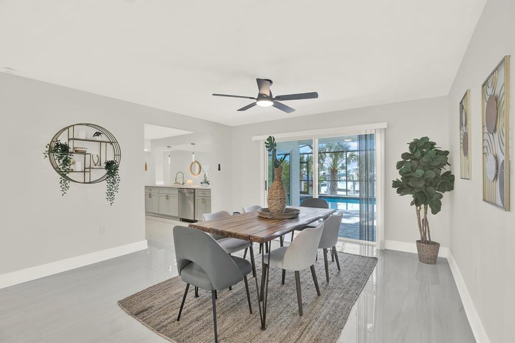 4346 Marine Parkway New Port Richey, FL 34652 - Photo 18 of 61 a view of a dining room with furniture and a potted plant