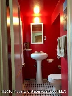 601 East Avenue Rifle, CO 81650 - Photo 3 of 15 a bathroom with a sink toilet and mirror