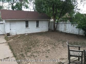 601 East Avenue Rifle, CO 81650 - Photo 8 of 15 a backyard of a house with table and chairs