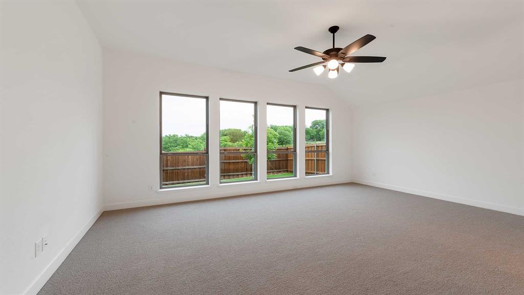 829 Stoney Bridge Way Lavon, TX 75166 - Photo 18 of 35 a view of a livingroom with a ceiling fan and window