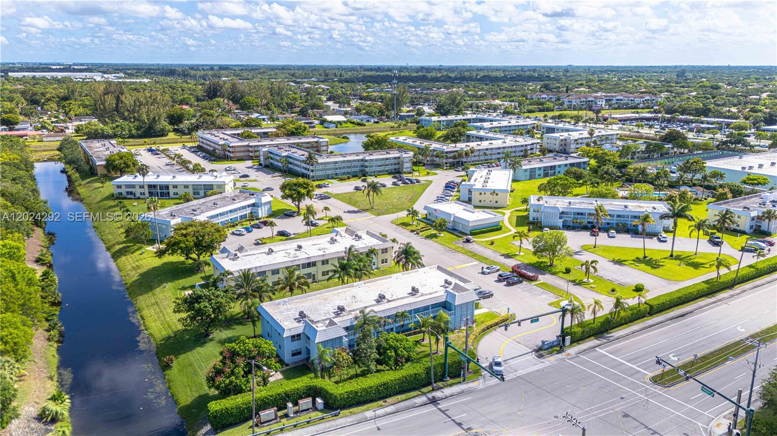 9780 Marina Boulevard, Unit 424 Boca Raton, FL 33428 - Photo 2 of 32 an aerial view of residential houses with outdoor space