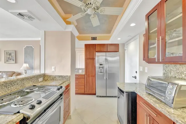 a kitchen with a stove and a refrigerator