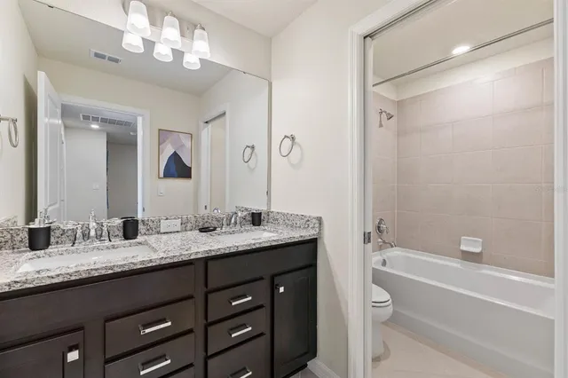 a bedroom with a bed and a table in it