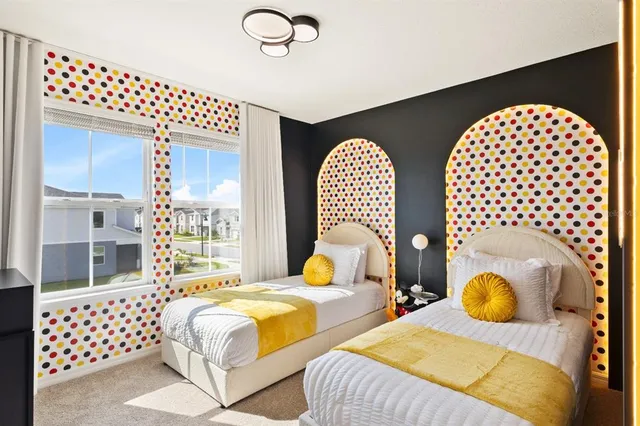 a bathroom with a granite countertop double vanity sink a mirror and shower