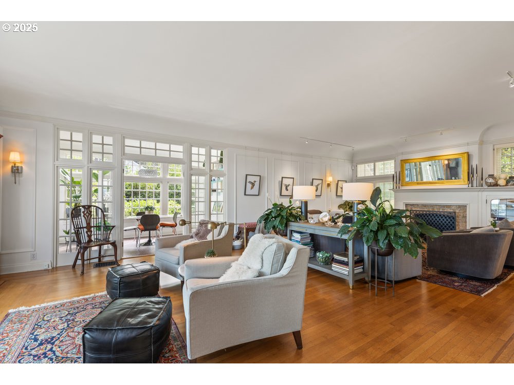 2677 Northwest Westover Road Portland, OR 97210 - Photo 19 of 48 a living room with furniture potted plant floor to ceiling window and wooden floor