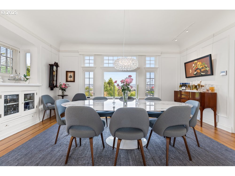 2677 Northwest Westover Road Portland, OR 97210 - Photo 21 of 48 a view of a dining room with furniture window and wooden floor