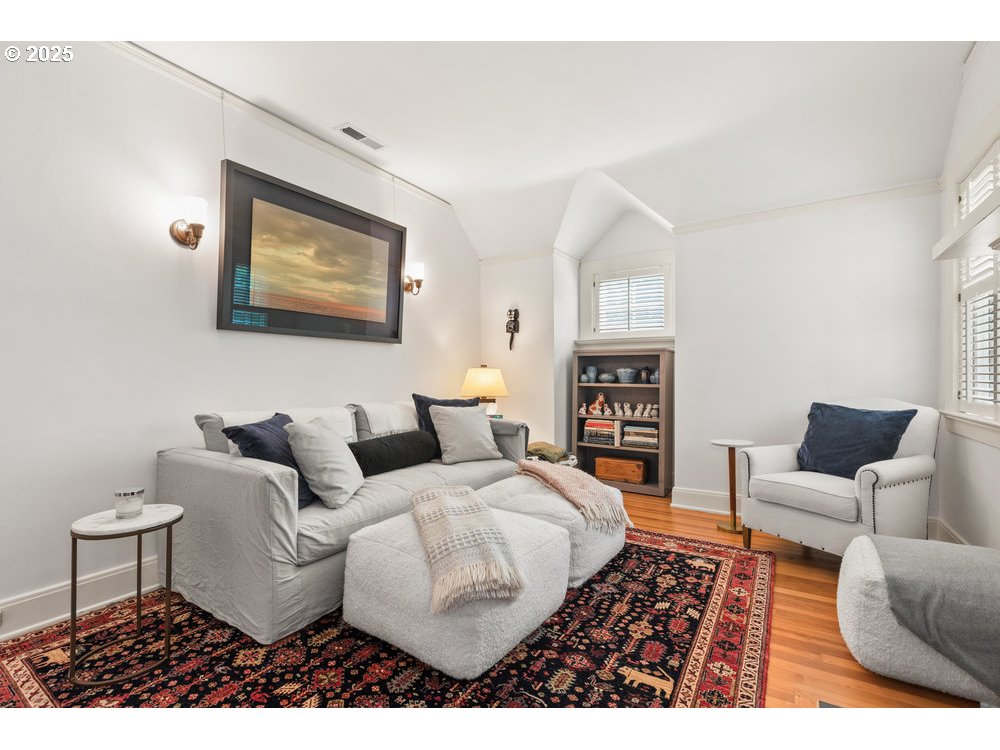 2677 Northwest Westover Road Portland, OR 97210 - Photo 33 of 48 a living room with furniture a flat screen tv and a fireplace