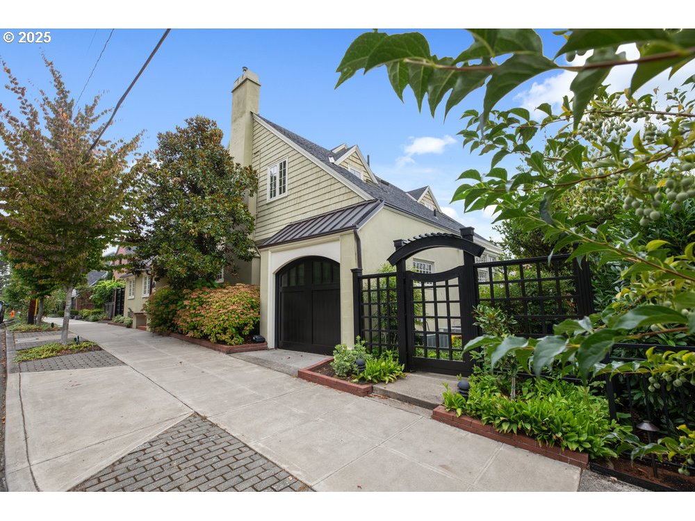 2677 Northwest Westover Road Portland, OR 97210 - Photo 4 of 48 a front view of a house with garden