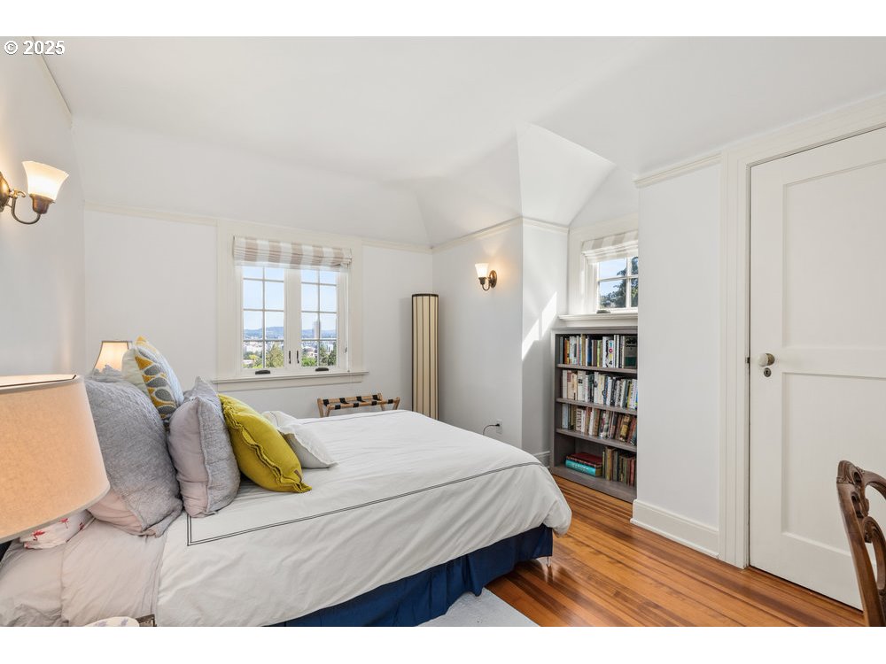 2677 Northwest Westover Road Portland, OR 97210 - Photo 42 of 48 a bedroom with a bed a rug and a large window